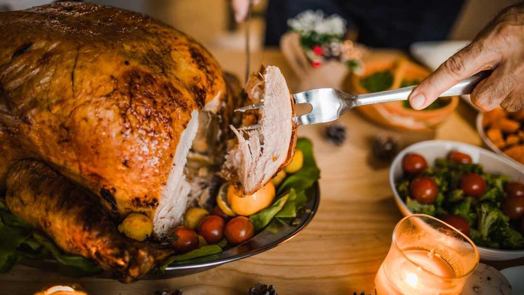 Person carving a turkey