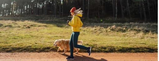 Woman jogging with her dog